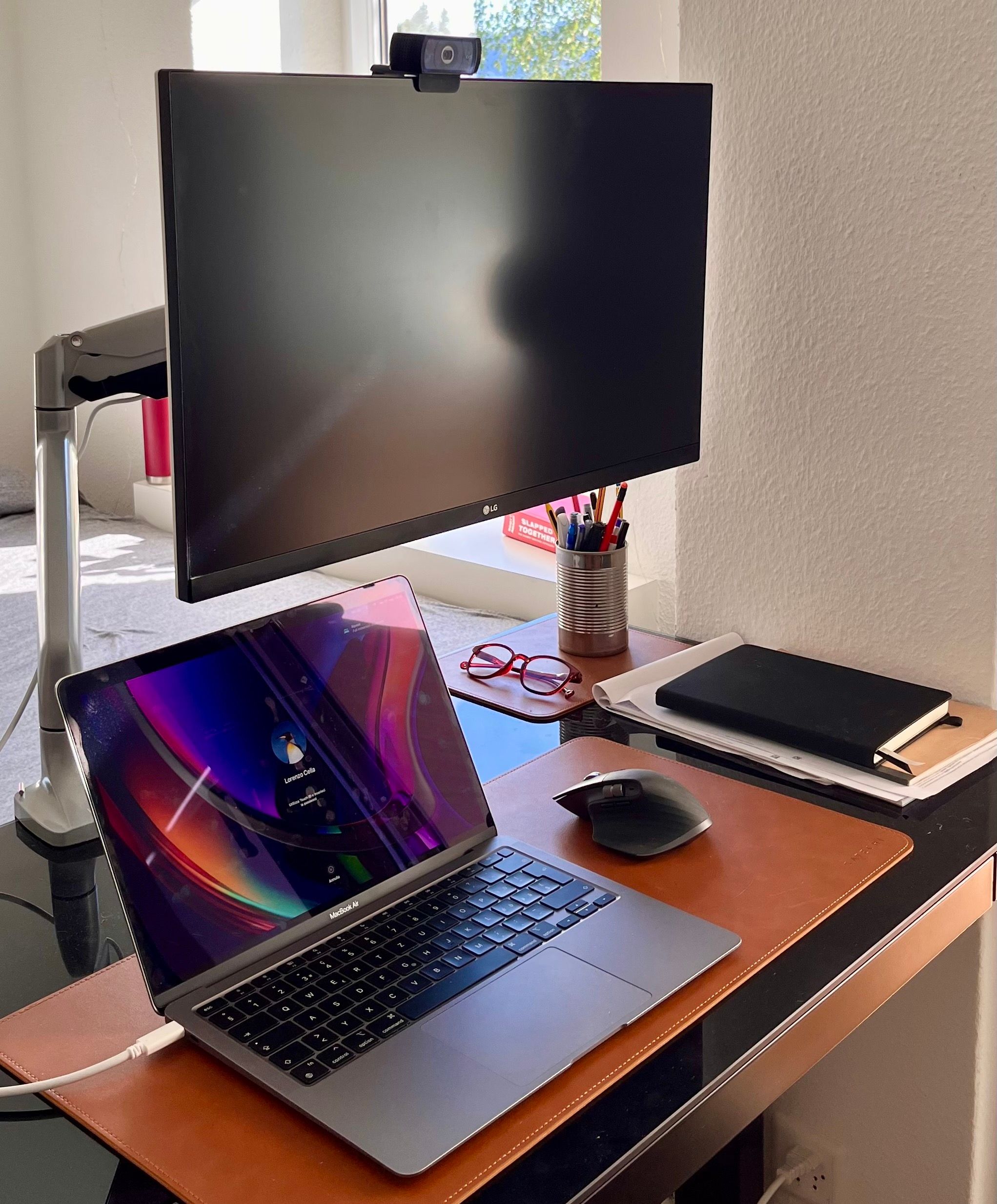 a monitor and a mabook on a desk